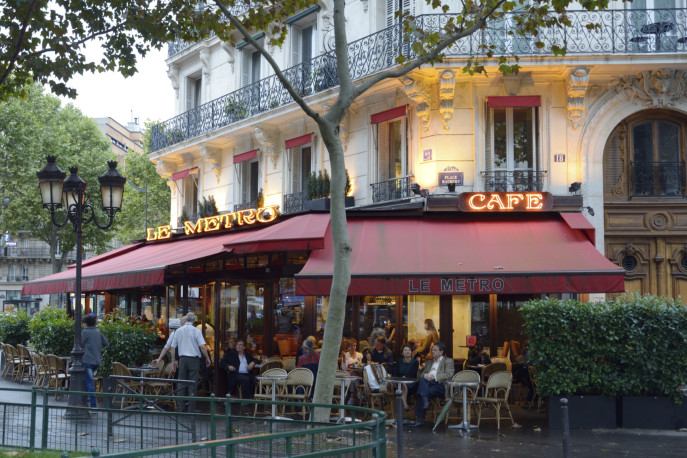 Paris, France - September 13, 2013: People resting in the street terrace of cafe Le Metro. Located on the place Maubert, the cafe provide the fine service for tourists